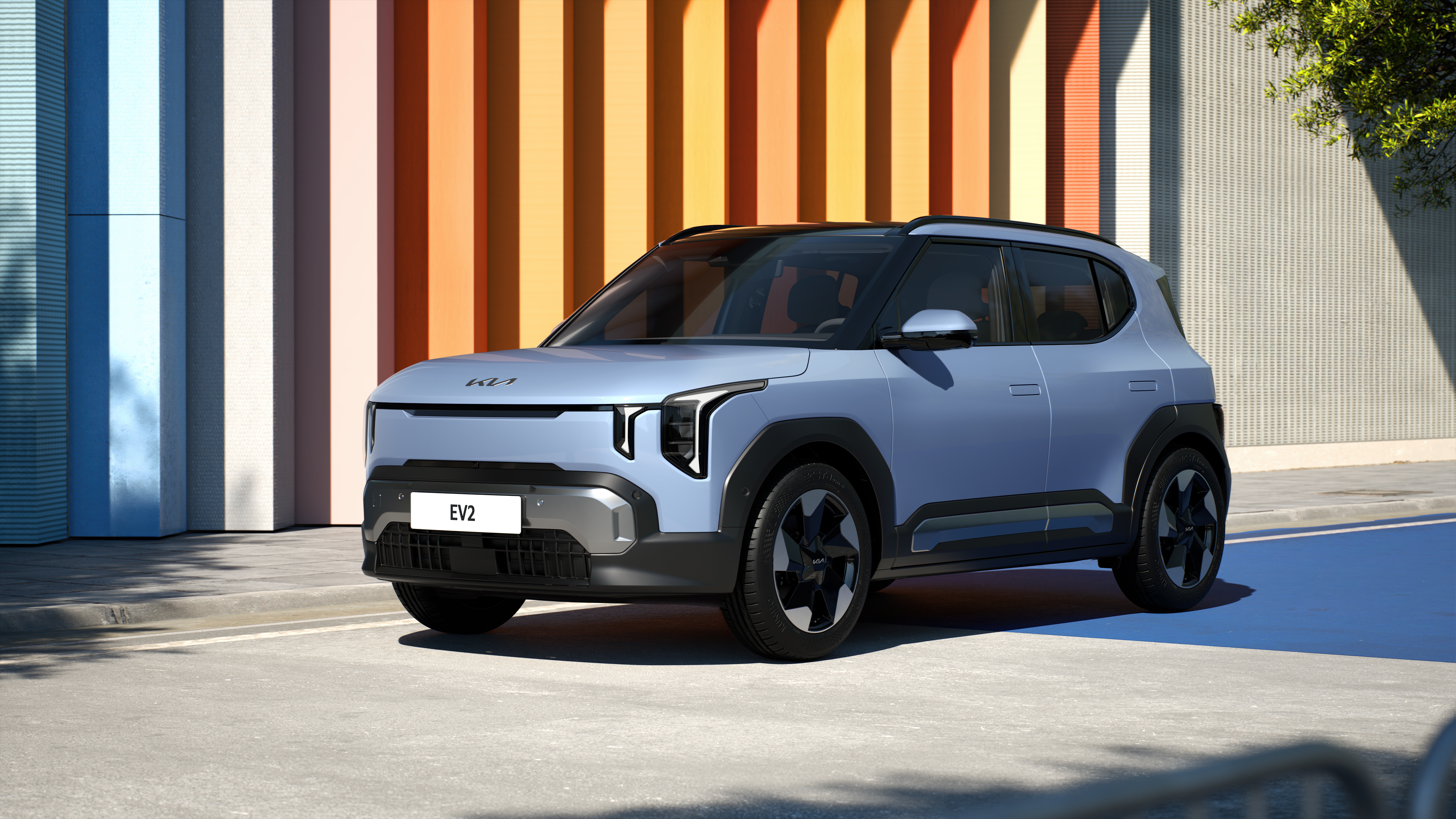 Kia EV2 compact electric SUV shown in an urban setting.