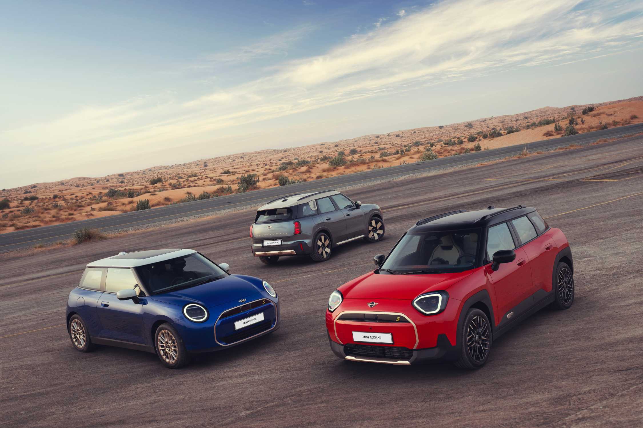 Three MINI electric models on a desert test track